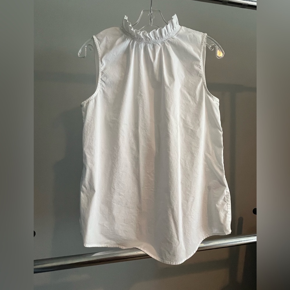 Cute Ruffle neck sleeveless top. White.